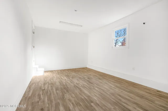 a view of a park with large trees