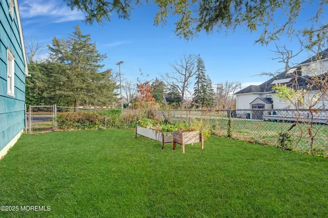 an aerial view of lake and residential houses with outdoor space