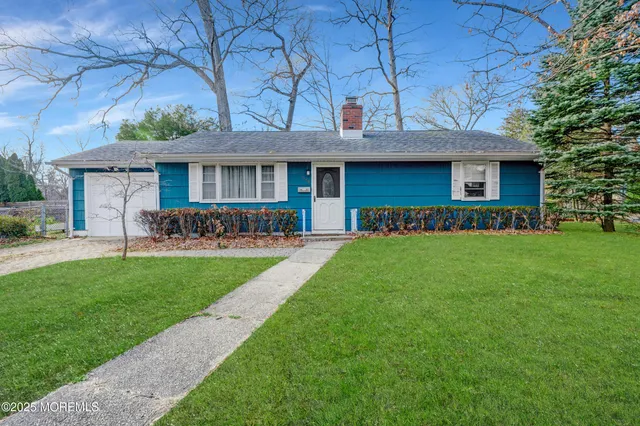 a view of a park with large trees