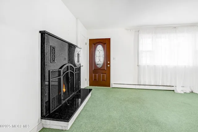 a view of a livingroom with wooden floor