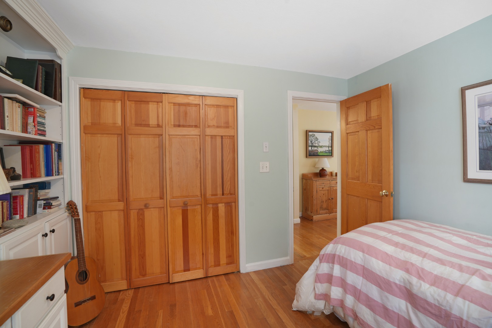 22 Old Lighthouse Road Vineyard Haven, MA 02568 - Photo 12 of 26 a bedroom with a bed and a book shelf