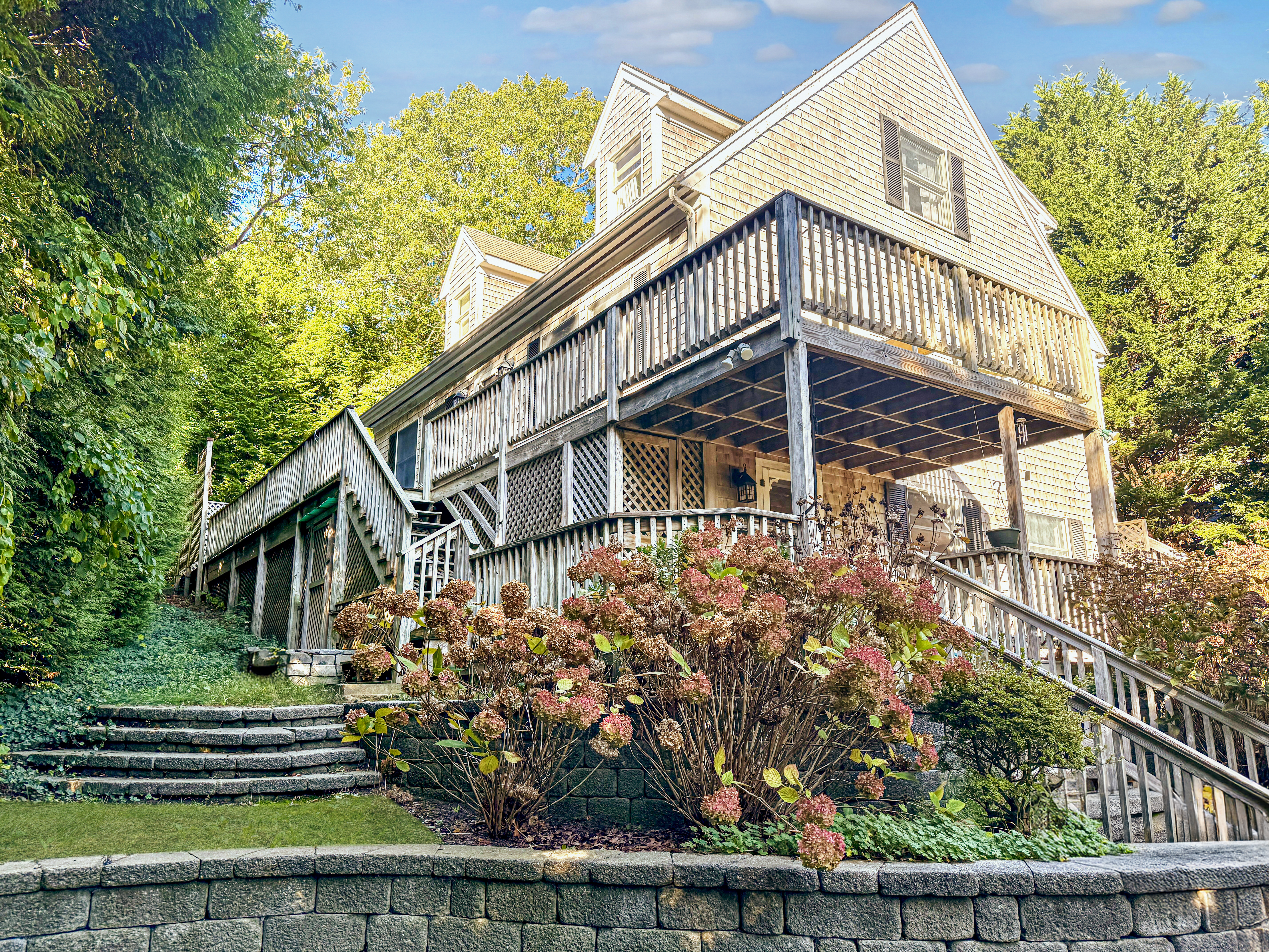 22 Old Lighthouse Road Vineyard Haven, MA 02568 - Photo 2 of 26 a view of a house with wooden fence
