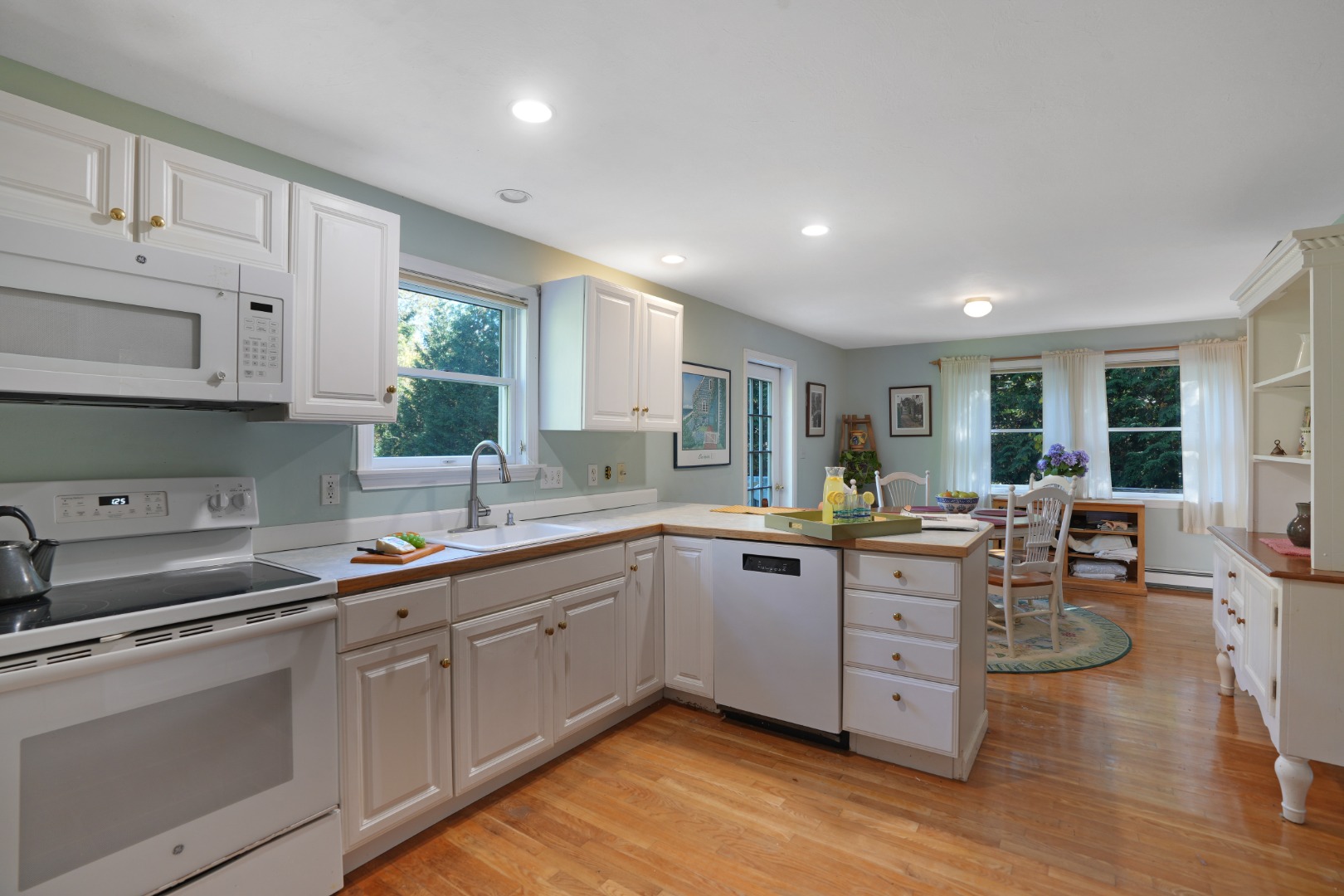 22 Old Lighthouse Road Vineyard Haven, MA 02568 - Photo 5 of 26 a kitchen with sink stove and cabinets