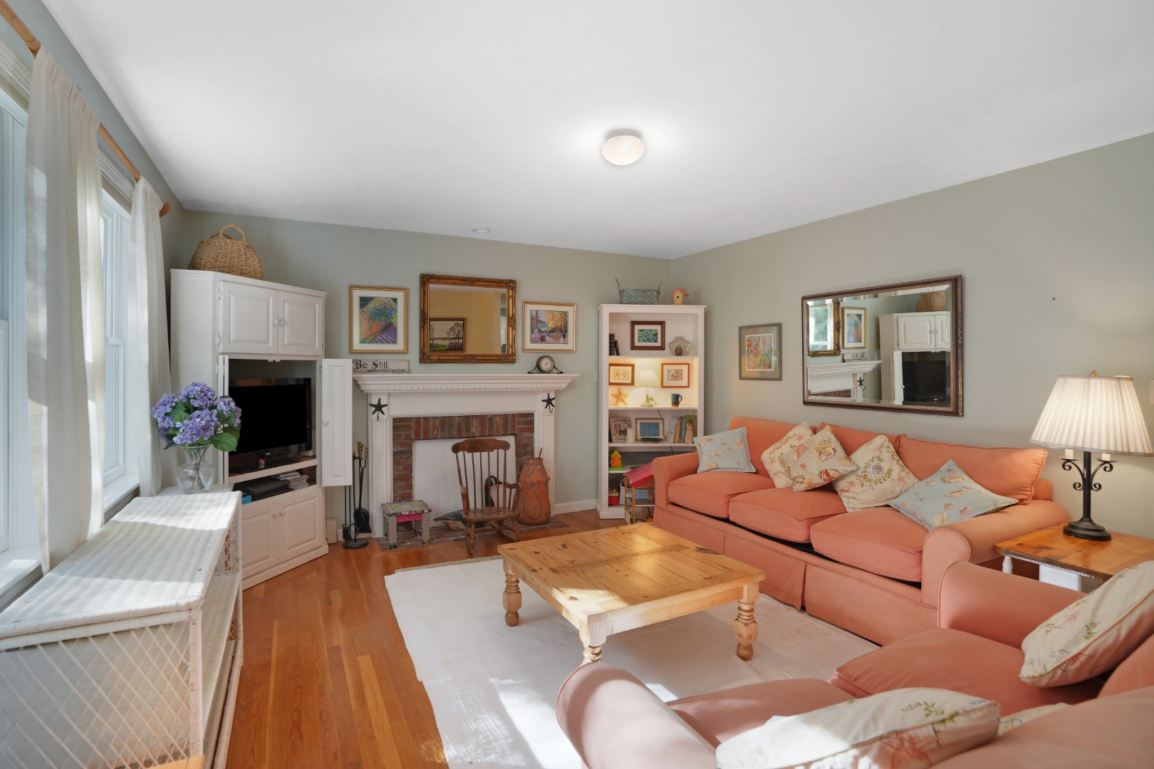 22 Old Lighthouse Road Vineyard Haven, MA 02568 - Photo 10 of 26 a living room with furniture and a fireplace