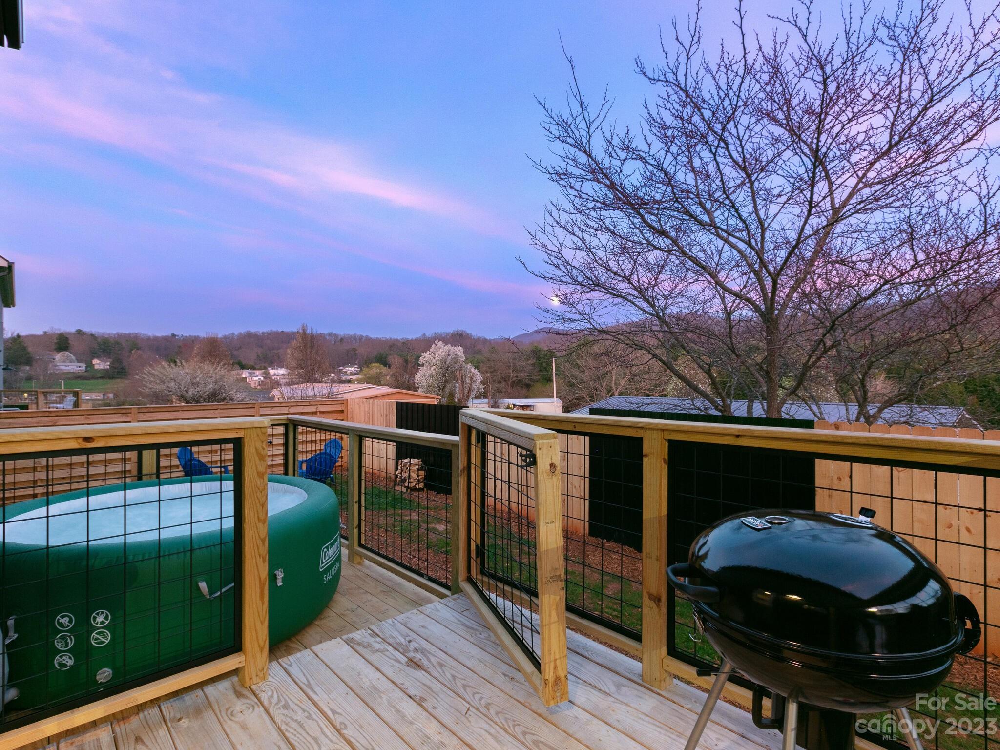 485 Oakdale Road Waynesville, NC 28786 - Photo 15 of 22 a view of balcony with furniture and wooden floor