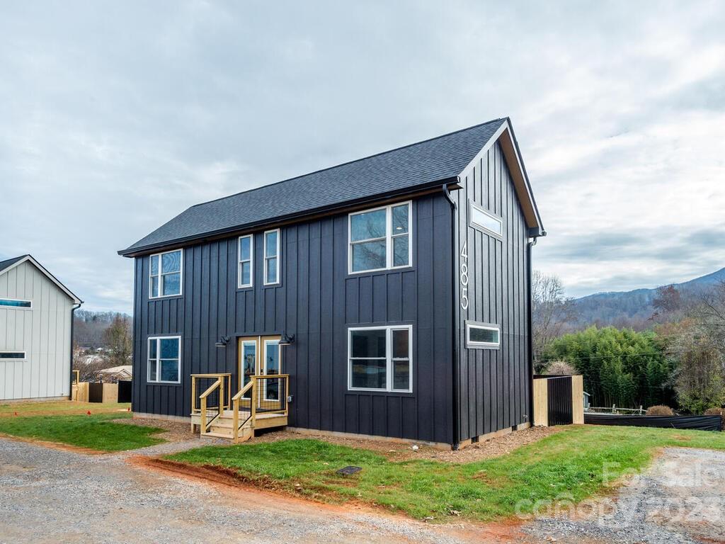 485 Oakdale Road Waynesville, NC 28786 - Photo 20 of 22 a front view of a house with garden