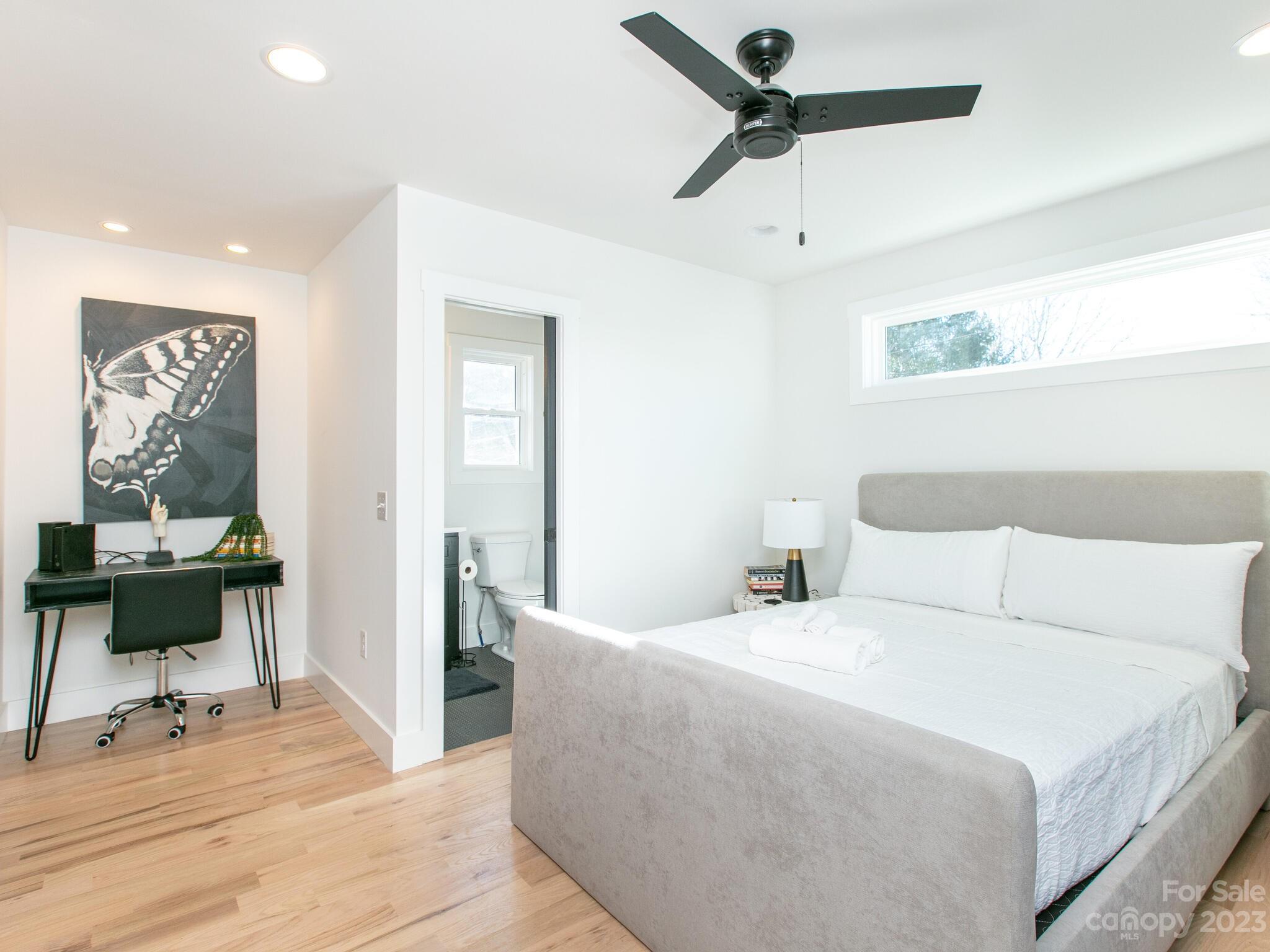485 Oakdale Road Waynesville, NC 28786 - Photo 6 of 22 a bedroom with a bed and a table