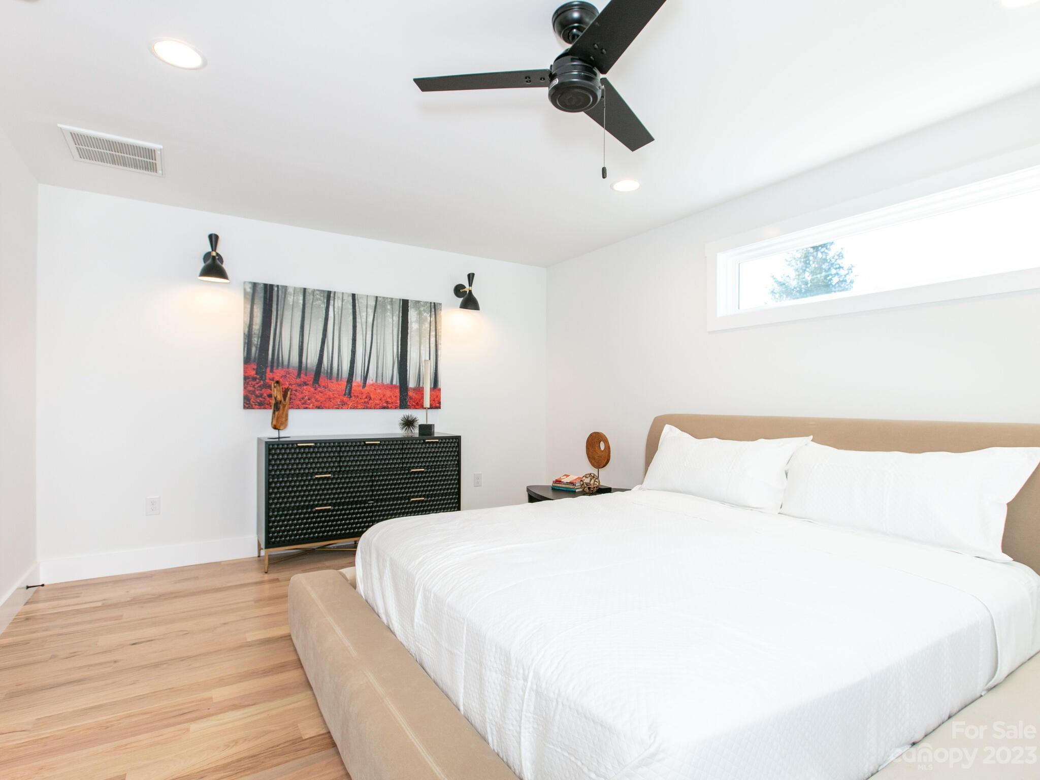 485 Oakdale Road Waynesville, NC 28786 - Photo 10 of 22 a bedroom with a bed and a dresser