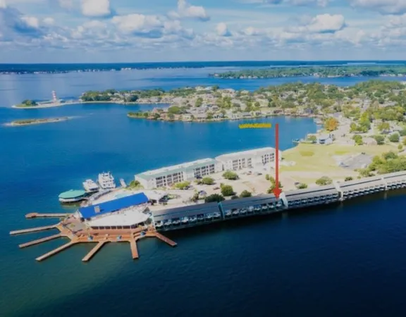a wooden floor with table and chairs