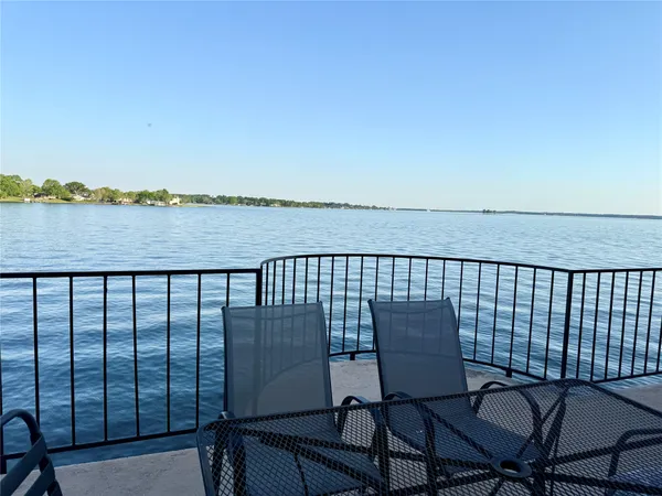 a view of a balcony with chair and table