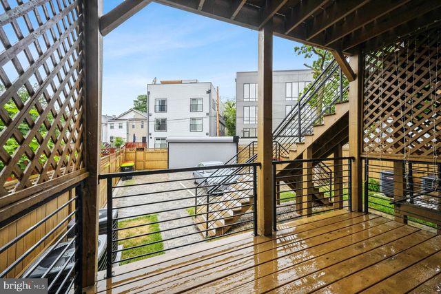 a view of balcony and deck with wooden floor