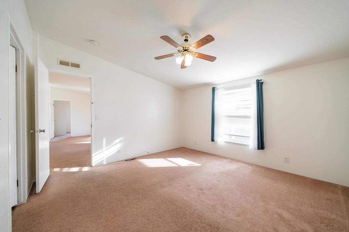 2016 Westerly Drive Rosamond, CA 93560 - Photo 13 of 20 a view of a big room with chandelier fan and windows
