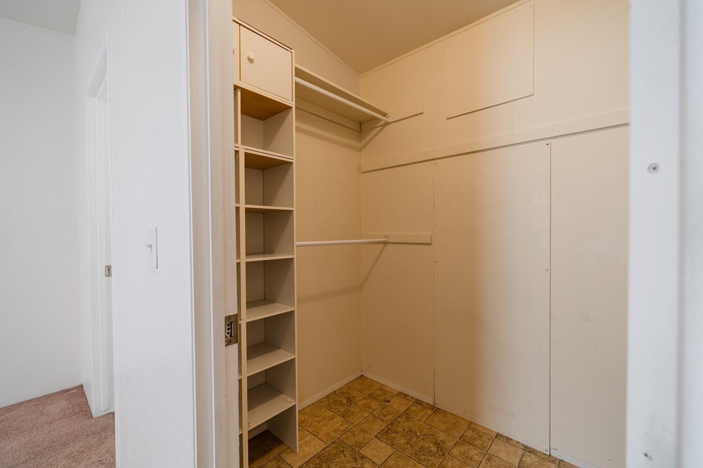 2016 Westerly Drive Rosamond, CA 93560 - Photo 15 of 20 a view of walk in closet with empty racks
