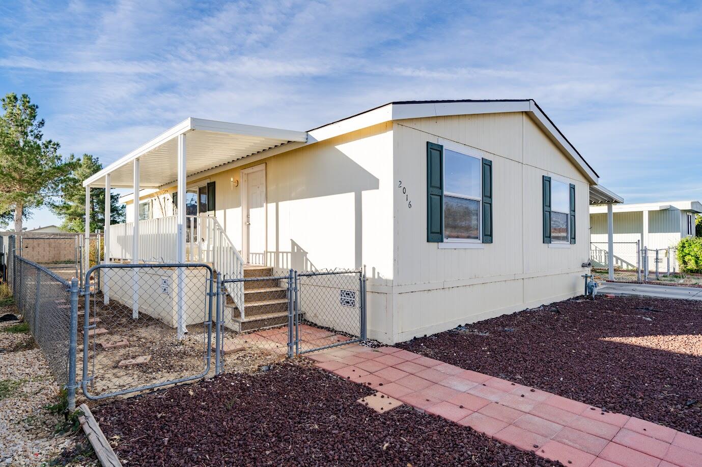 2016 Westerly Drive Rosamond, CA 93560 - Photo 2 of 20 a view of a house with a yard