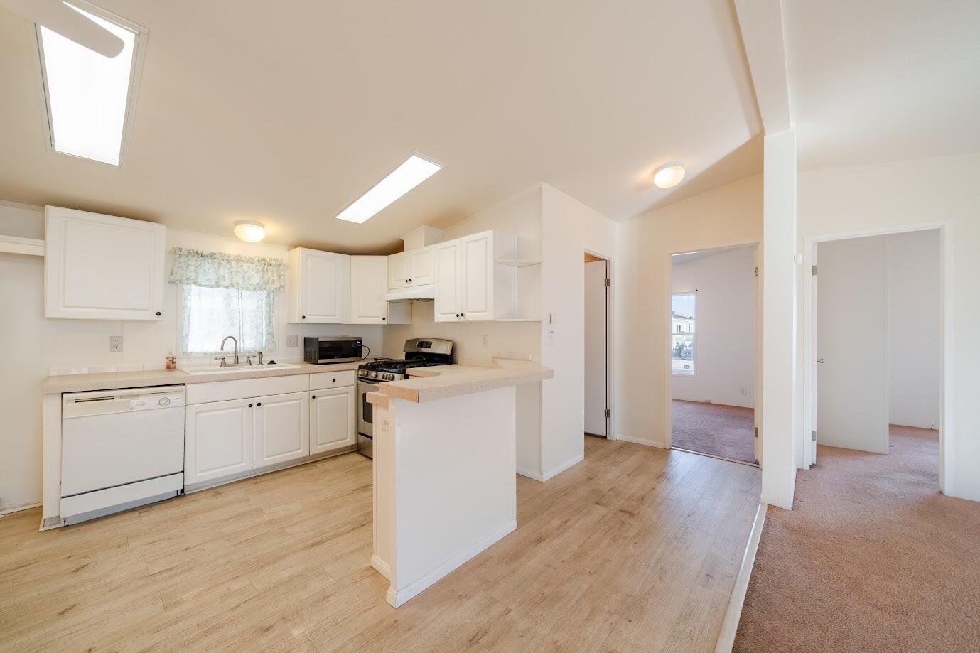 2016 Westerly Drive Rosamond, CA 93560 - Photo 5 of 20 a kitchen with cabinets and wooden floor