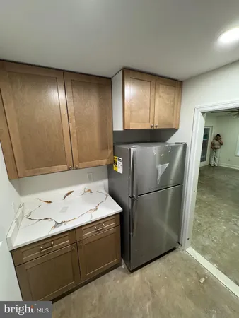 a room with a sink cabinets and utility room