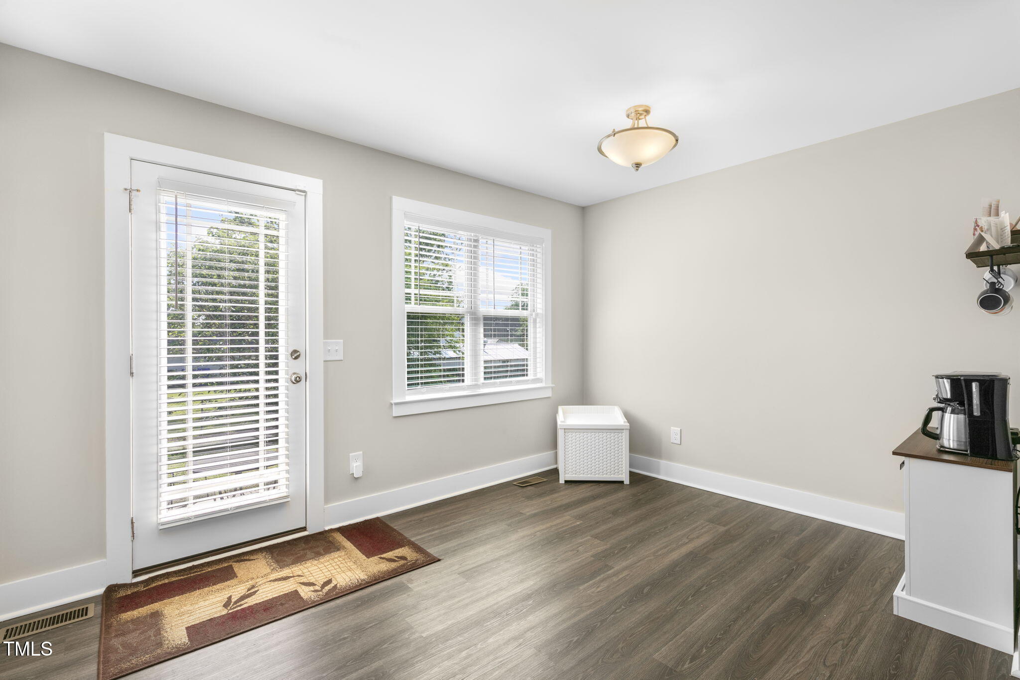 355 South Church Street Coats, NC 27521 - Photo 15 of 29 a view of a room with wooden floor and a window