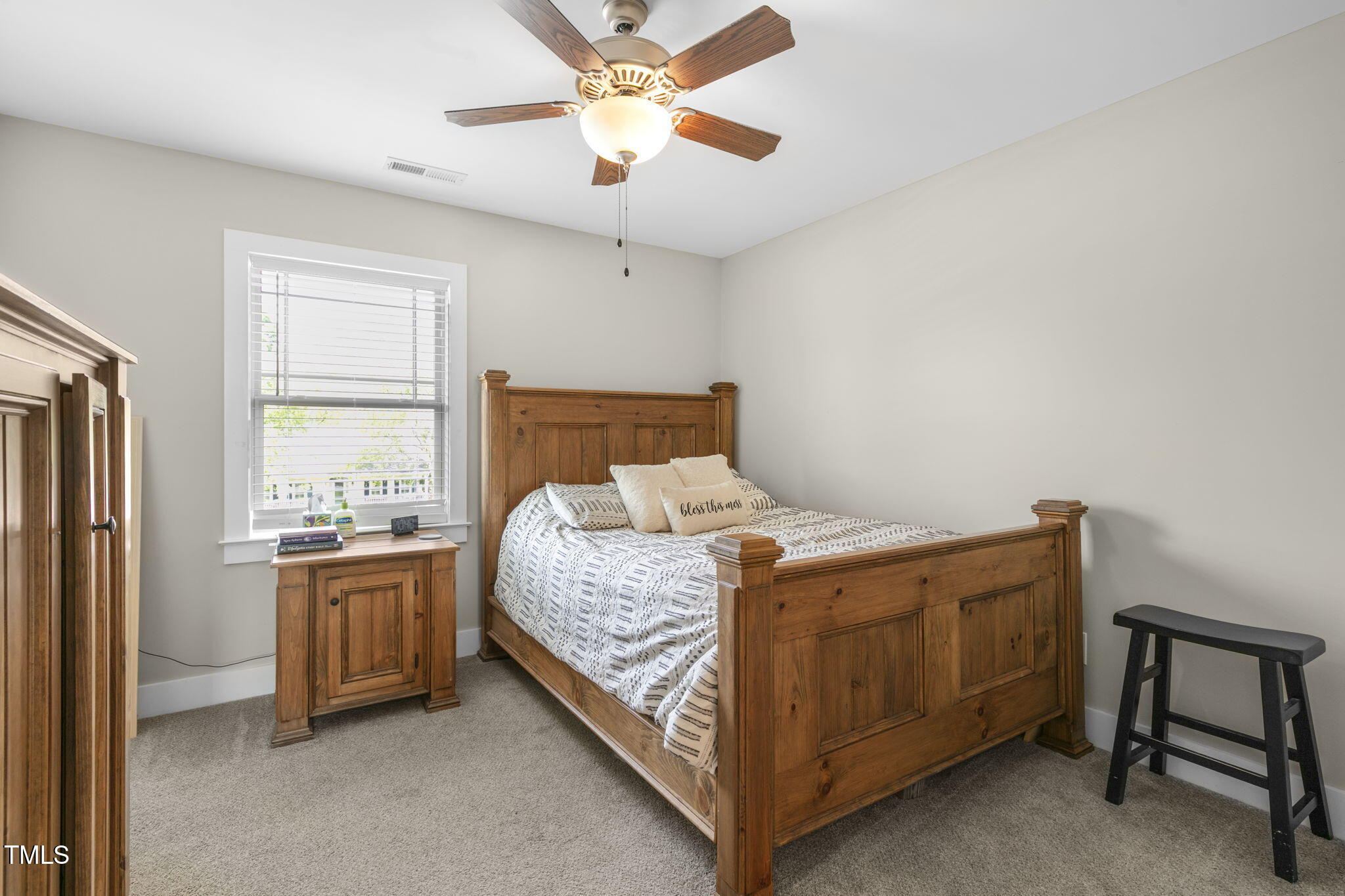 355 South Church Street Coats, NC 27521 - Photo 17 of 29 a bedroom with a bed and a window