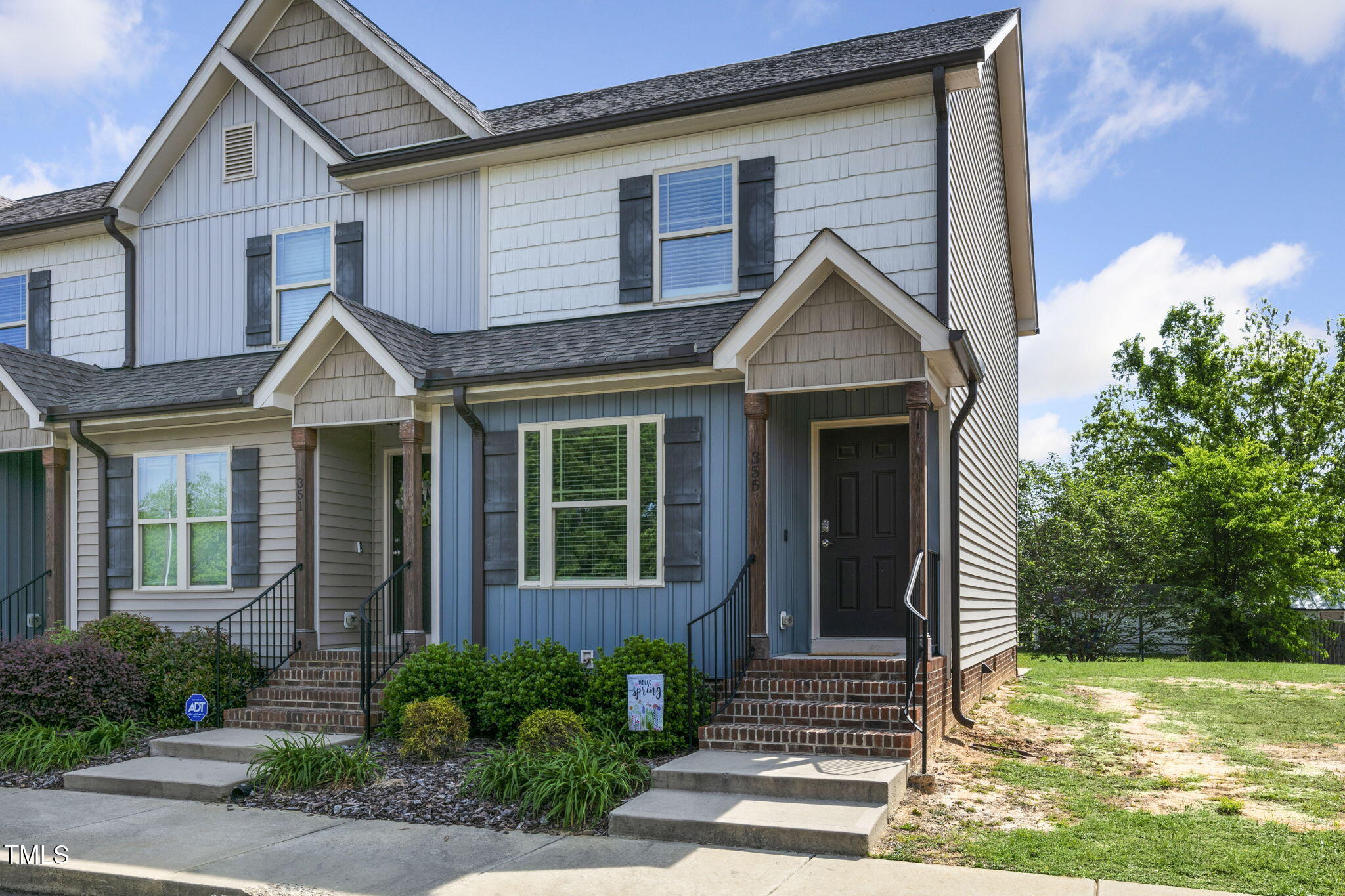 355 South Church Street Coats, NC 27521 - Photo 2 of 29 a front view of a house with garden