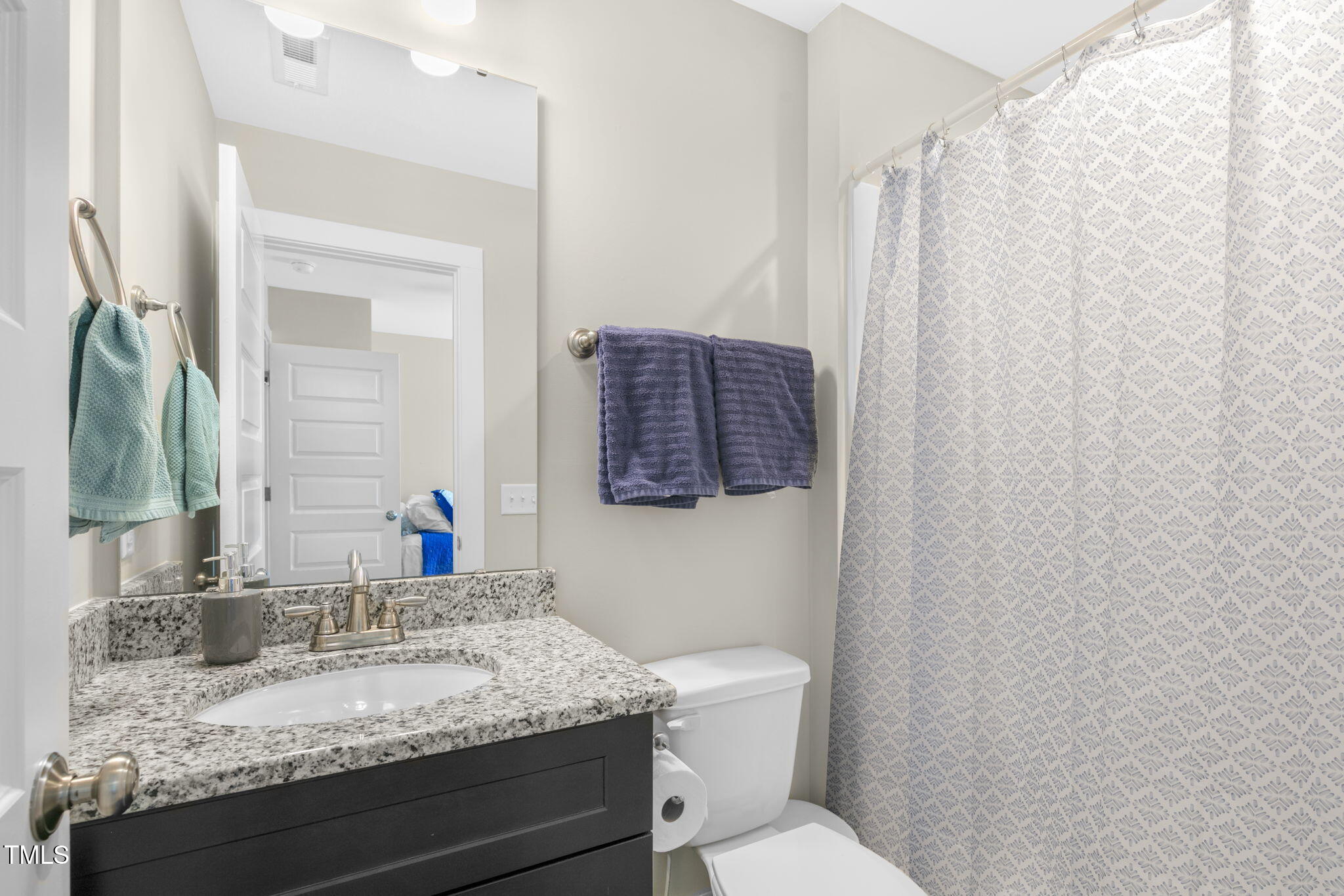 355 South Church Street Coats, NC 27521 - Photo 23 of 29 a bathroom with a granite countertop sink and a mirror