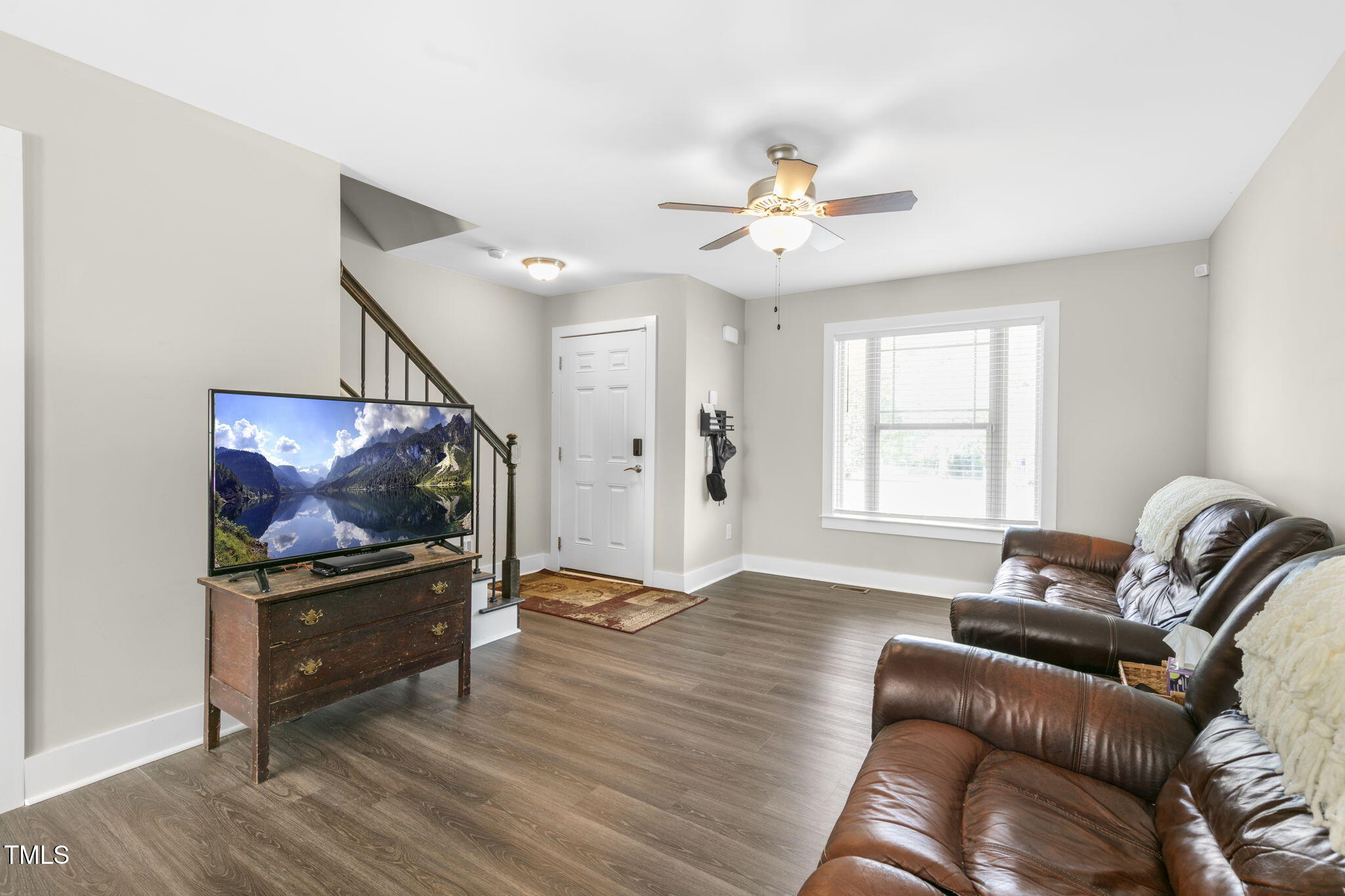 355 South Church Street Coats, NC 27521 - Photo 6 of 29 a living room with furniture and a flat screen tv