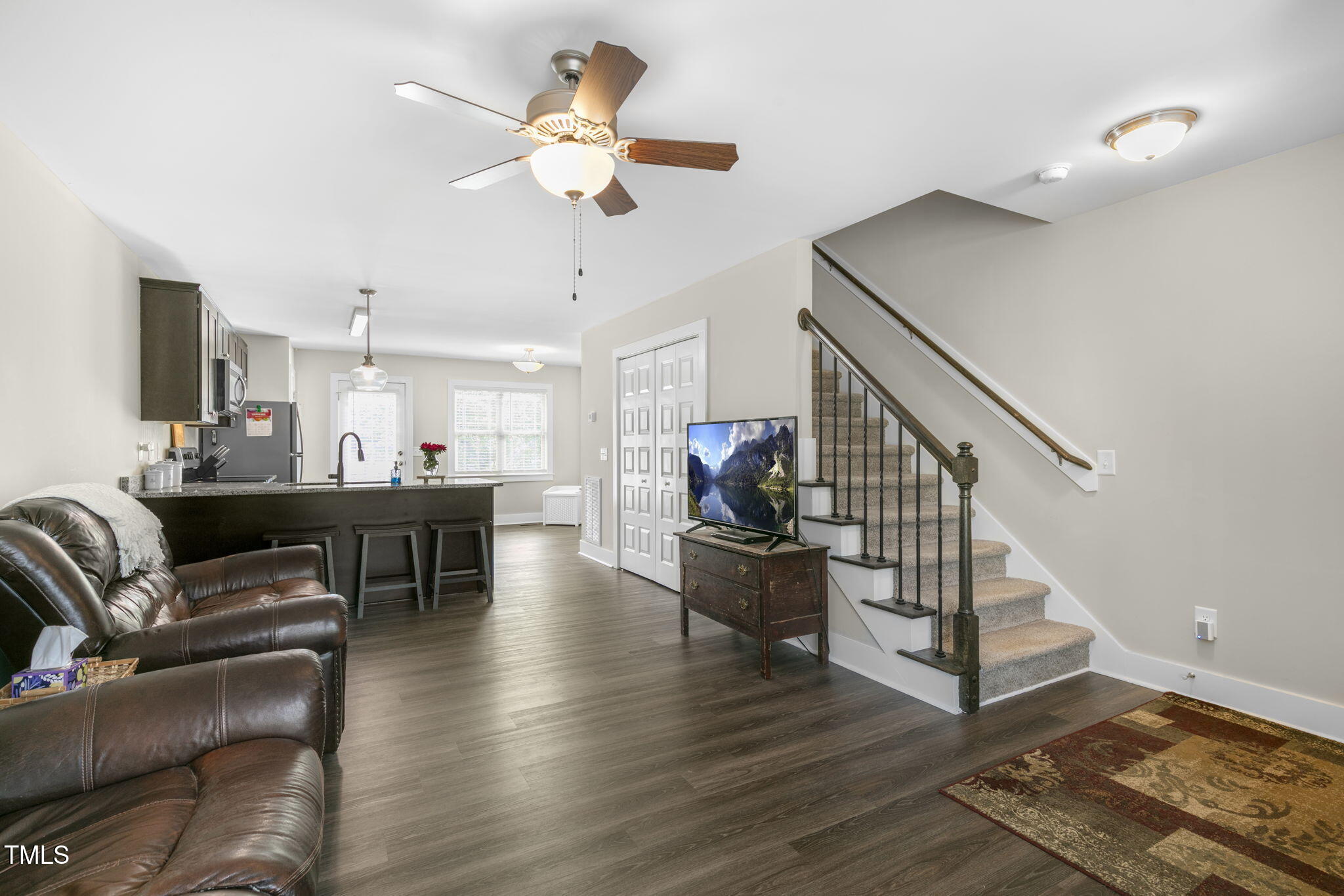 355 South Church Street Coats, NC 27521 - Photo 7 of 29 a living room with furniture and kitchen view