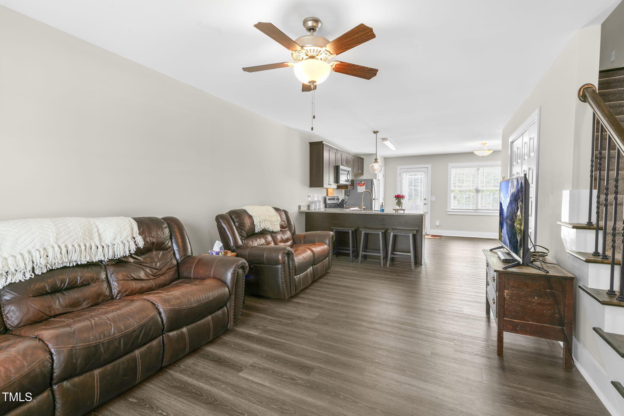 355 South Church Street Coats, NC 27521 - Photo 8 of 29 a living room with furniture and kitchen view