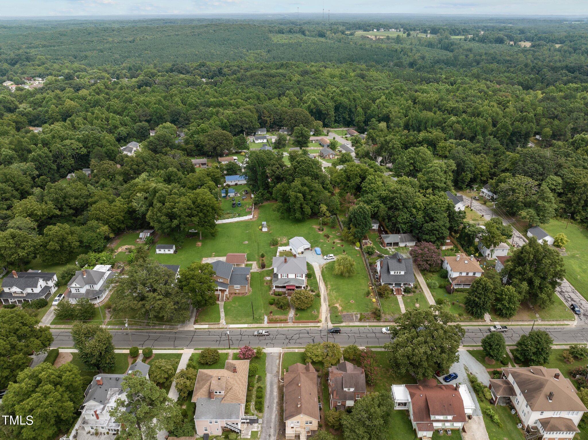 501 South Main Street Roxboro, NC 27573 - Photo 29 of 30 an aerial view of house with yard swimming pool and outdoor seating