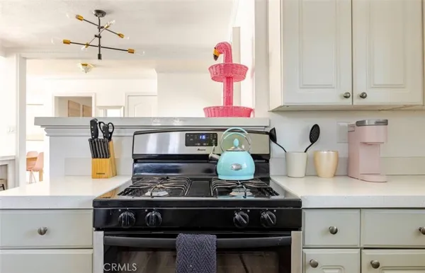 a stove top oven sitting inside of a kitchen
