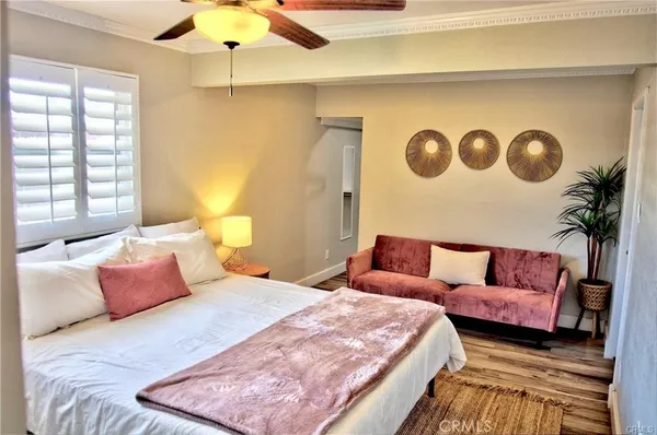 a bedroom with a bed and a couch