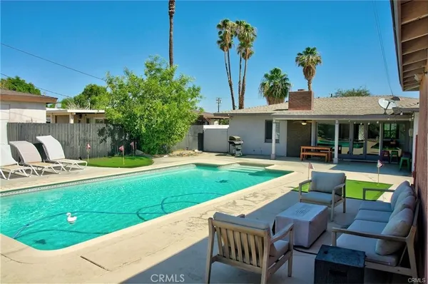 a view of a house with swimming pool yard and patio