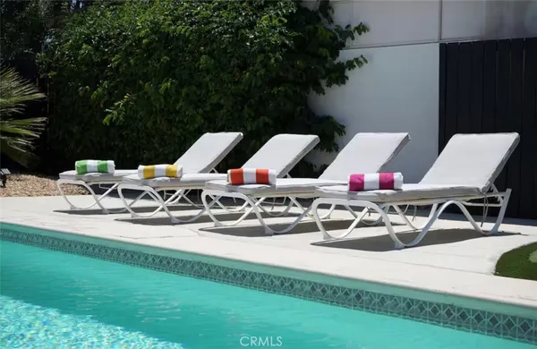 a view of swimming pool with seating space