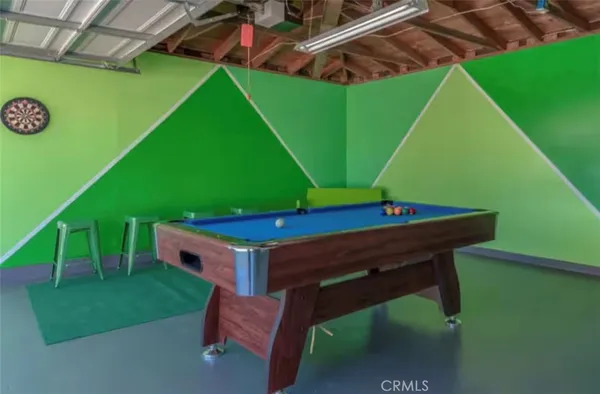 a view of a backyard with plants and a patio