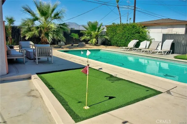 a view of a house with a yard patio and a patio