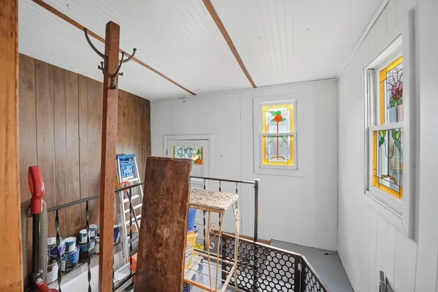 a view of entryway with furniture and window