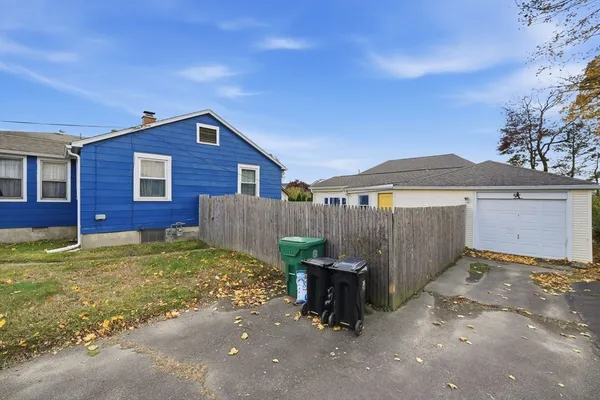 a view of a house with a yard and garage