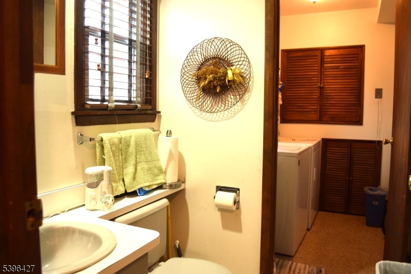 27 3rd Avenue Roseland, NJ 07068 - Photo 13 of 16 a bathroom with a sink and a mirror