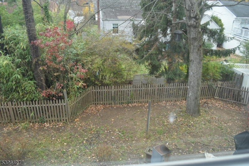 27 3rd Avenue Roseland, NJ 07068 - Photo 14 of 16 a backyard of a house with lots of green space
