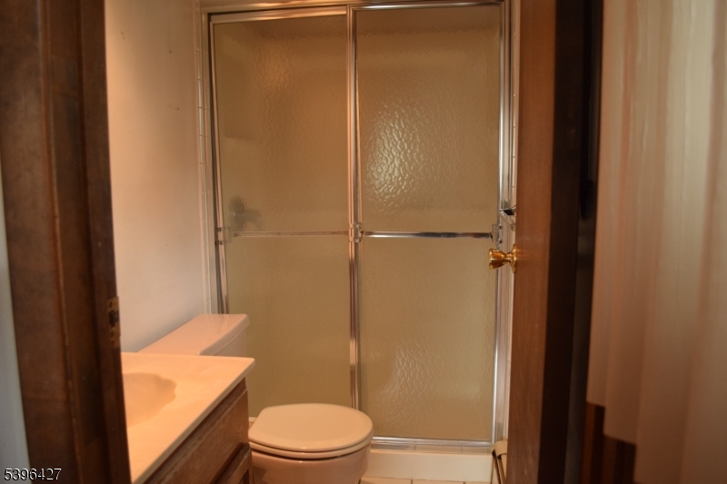 27 3rd Avenue Roseland, NJ 07068 - Photo 5 of 16 a bathroom with a granite countertop toilet