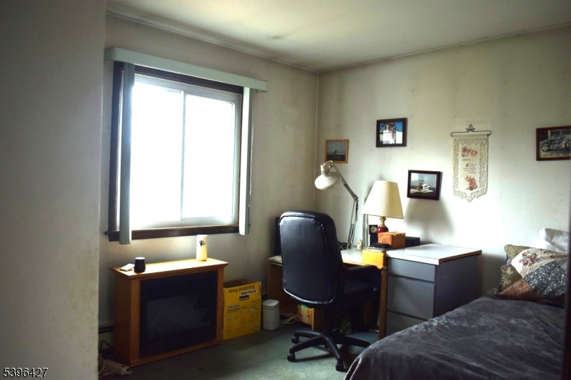 27 3rd Avenue Roseland, NJ 07068 - Photo 6 of 16 a view of a workspace with furniture and a window