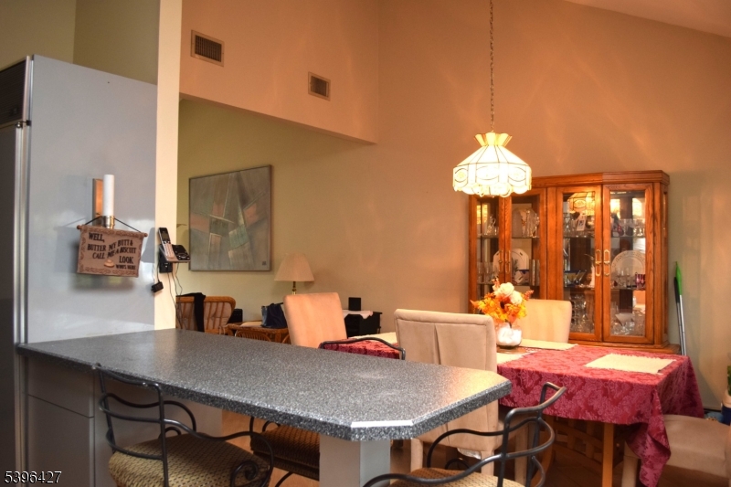 27 3rd Avenue Roseland, NJ 07068 - Photo 8 of 16 a view of a dining room with furniture and chandelier