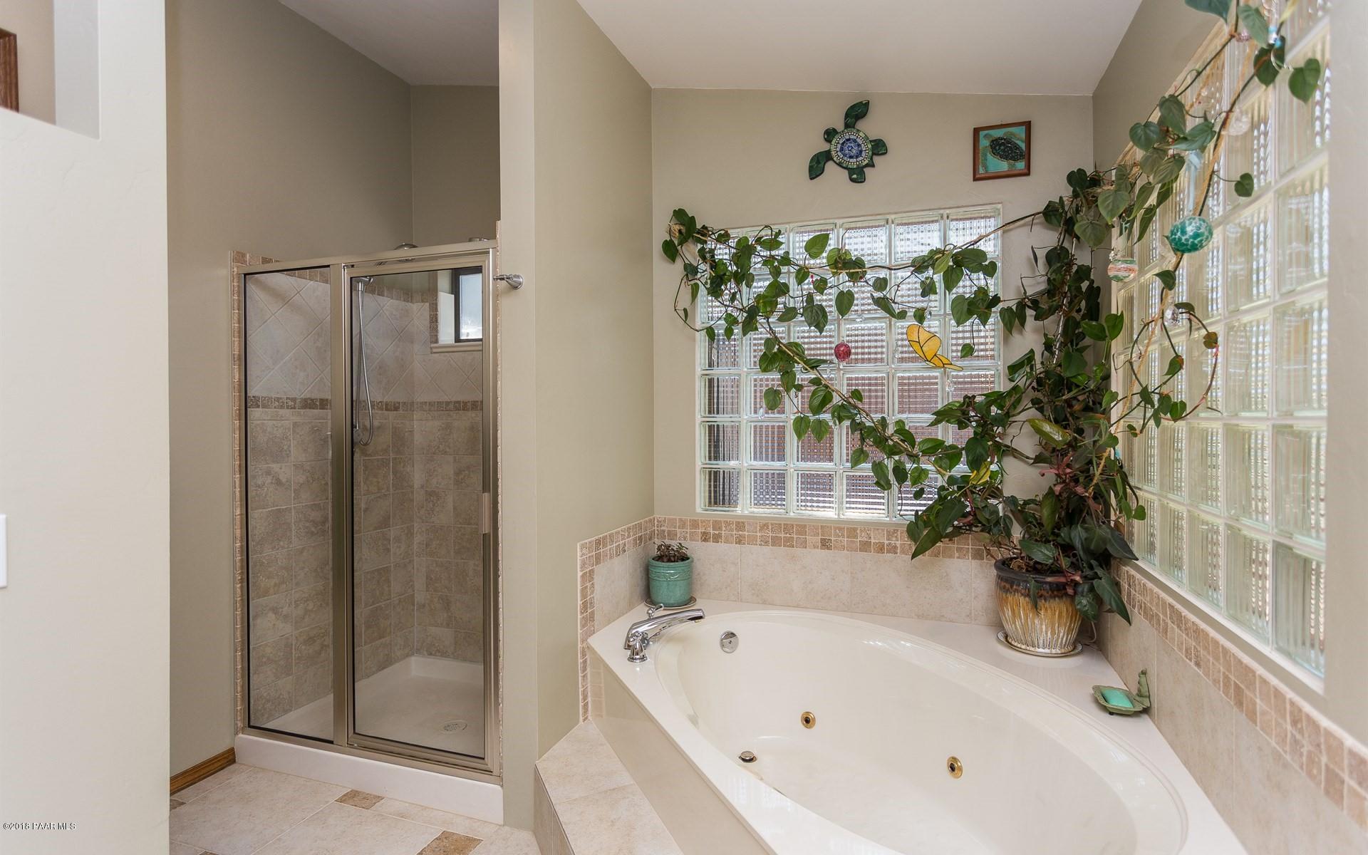 1631 Kaibab Loop Prescott, AZ 86303 - Photo 15 of 45 a bathroom with a bathtub and shower