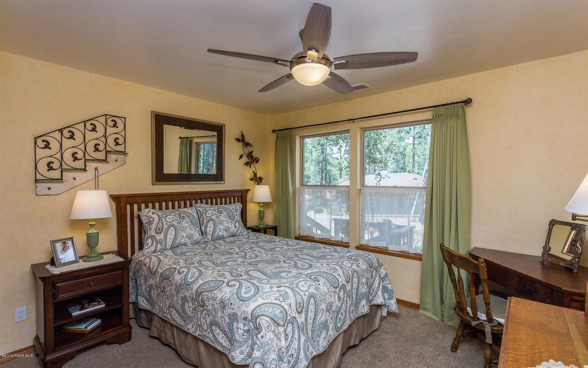 1631 Kaibab Loop Prescott, AZ 86303 - Photo 17 of 45 a bedroom with a bed and a window