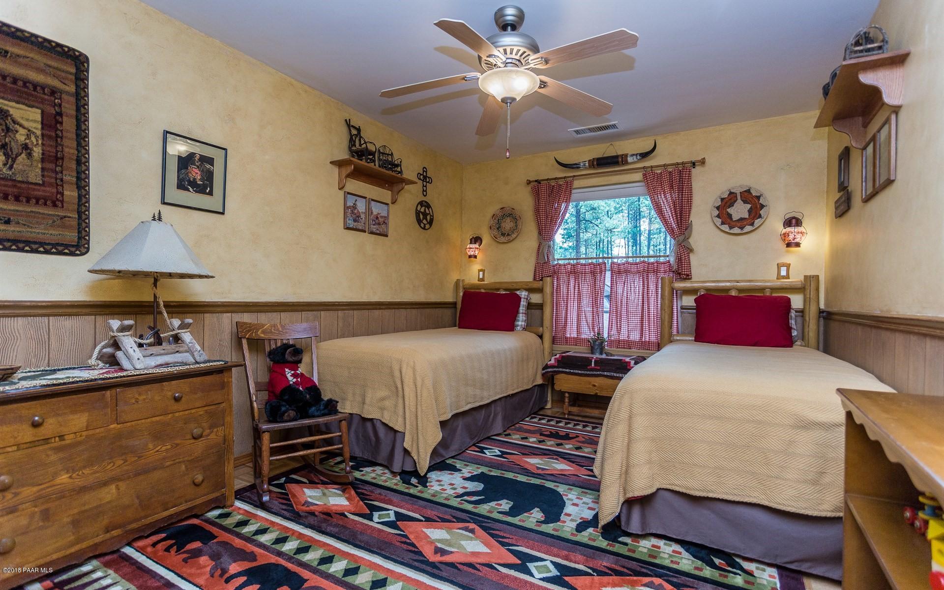 1631 Kaibab Loop Prescott, AZ 86303 - Photo 18 of 45 a bedroom with bed and a window