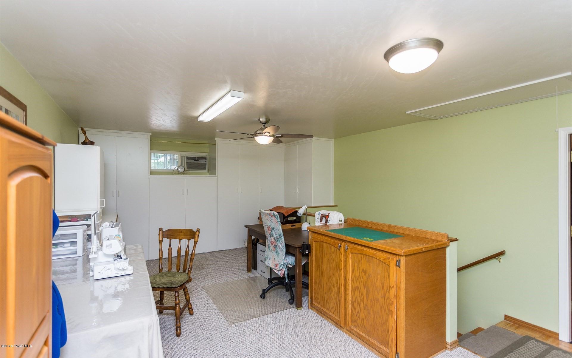 1631 Kaibab Loop Prescott, AZ 86303 - Photo 21 of 45 a view of a workspace with furniture and a window