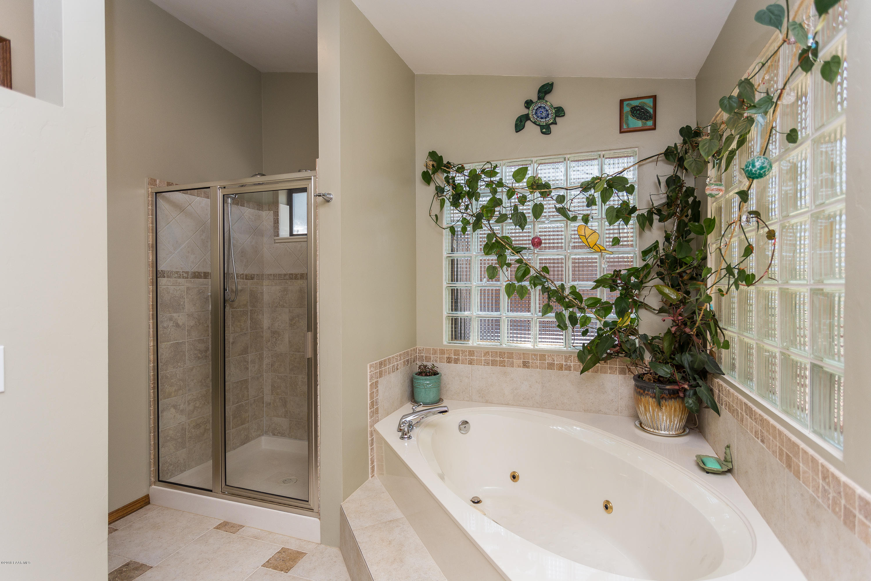 1631 Kaibab Loop Prescott, AZ 86303 - Photo 29 of 45 a bathroom with a bathtub and a shower