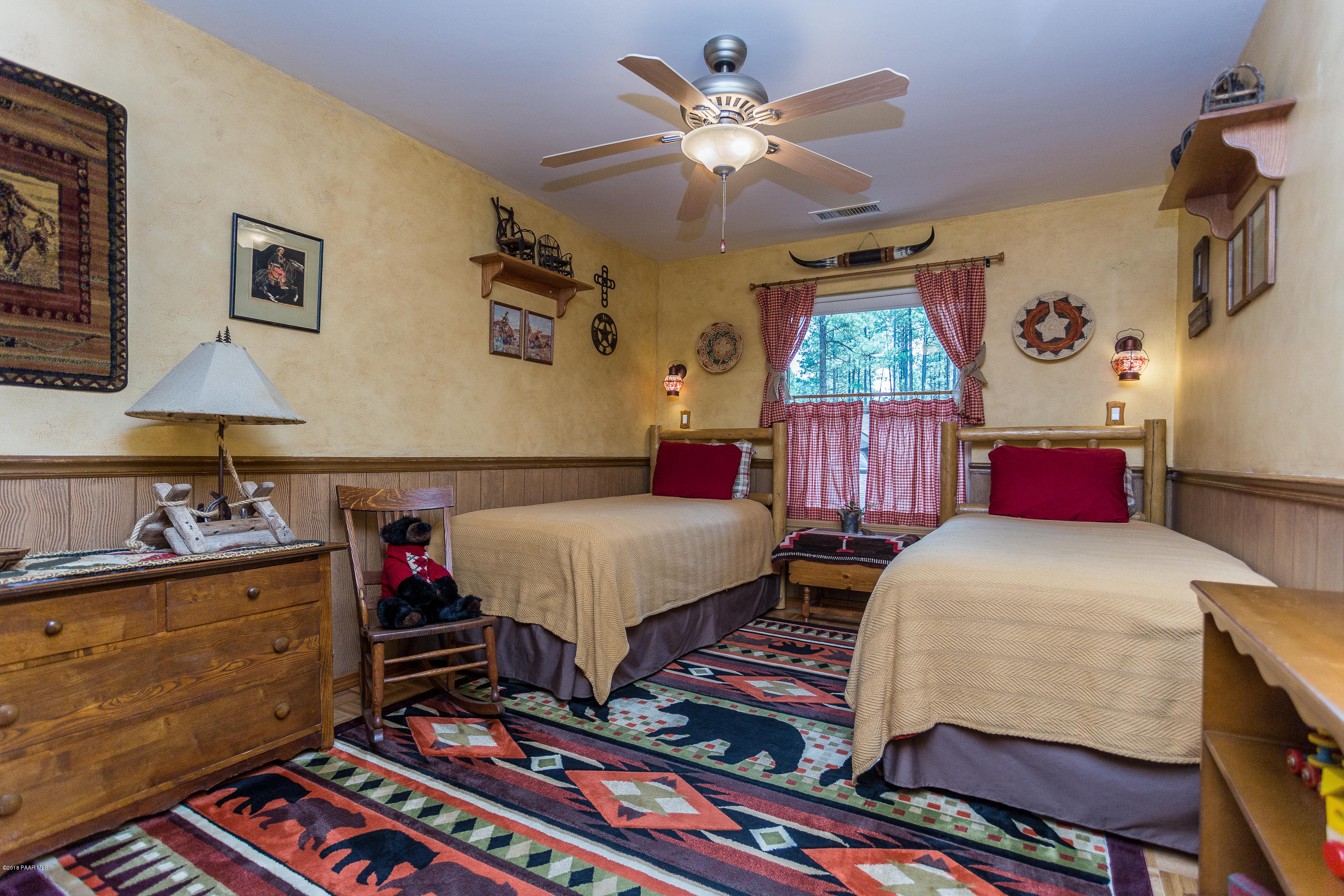 1631 Kaibab Loop Prescott, AZ 86303 - Photo 32 of 45 a bedroom with bed and a chandelier
