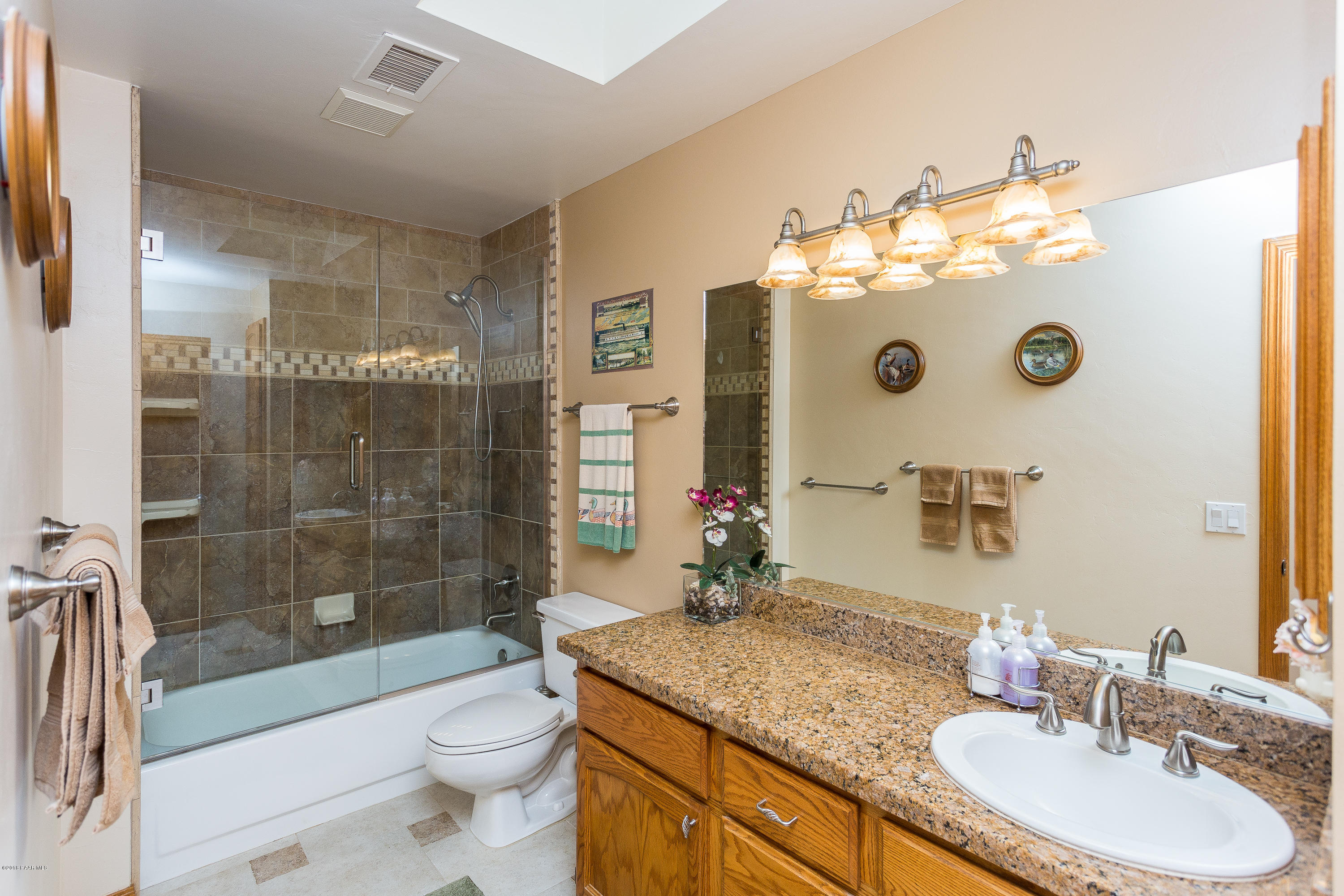 1631 Kaibab Loop Prescott, AZ 86303 - Photo 33 of 45 a bathroom with a granite countertop sink toilet and shower