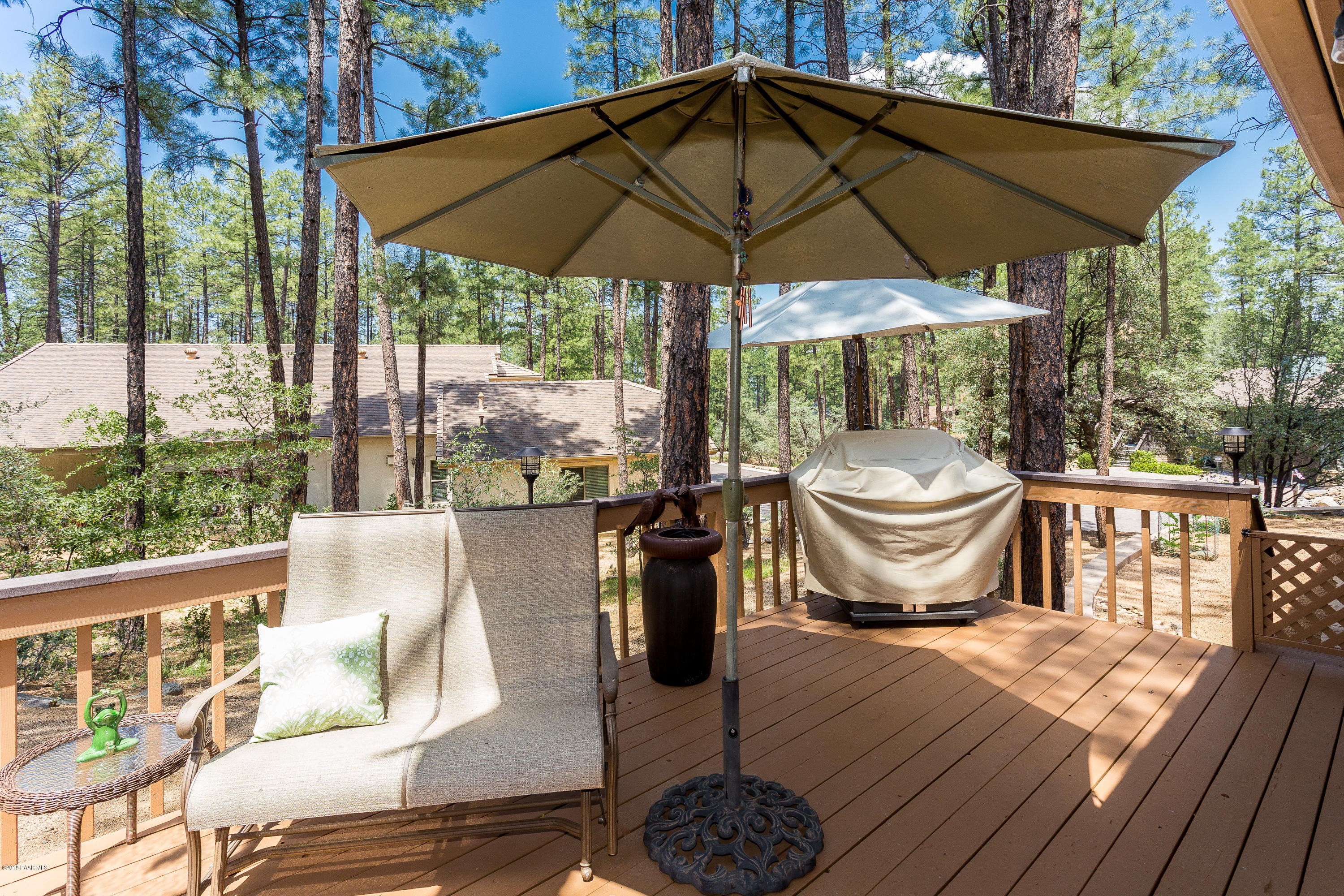 1631 Kaibab Loop Prescott, AZ 86303 - Photo 38 of 45 a table and chair under an umbrella