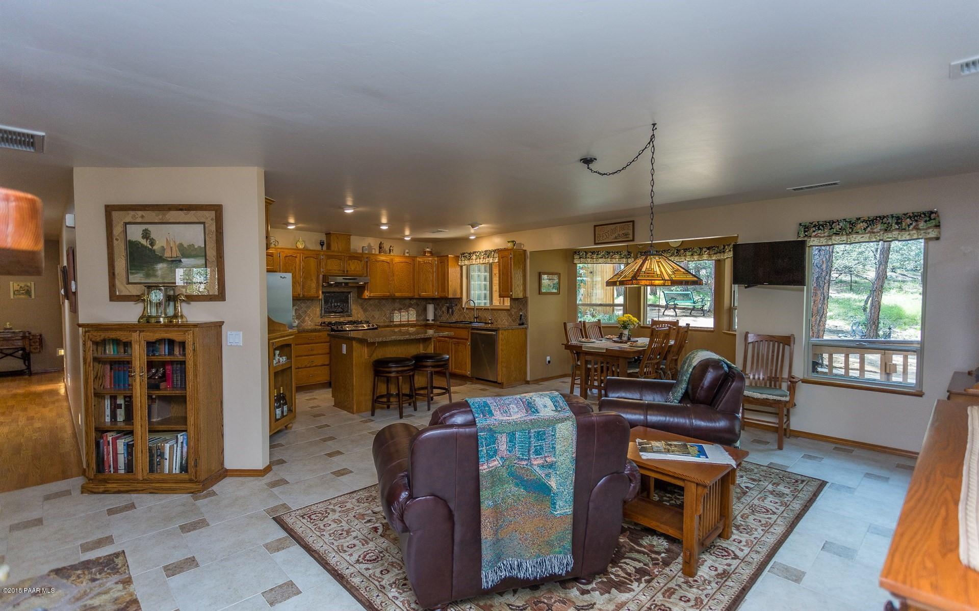 1631 Kaibab Loop Prescott, AZ 86303 - Photo 8 of 45 a living room with fireplace furniture and a flat screen tv